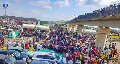 Photos As #EndSARS Protesters Occupy Expressway In Abuja